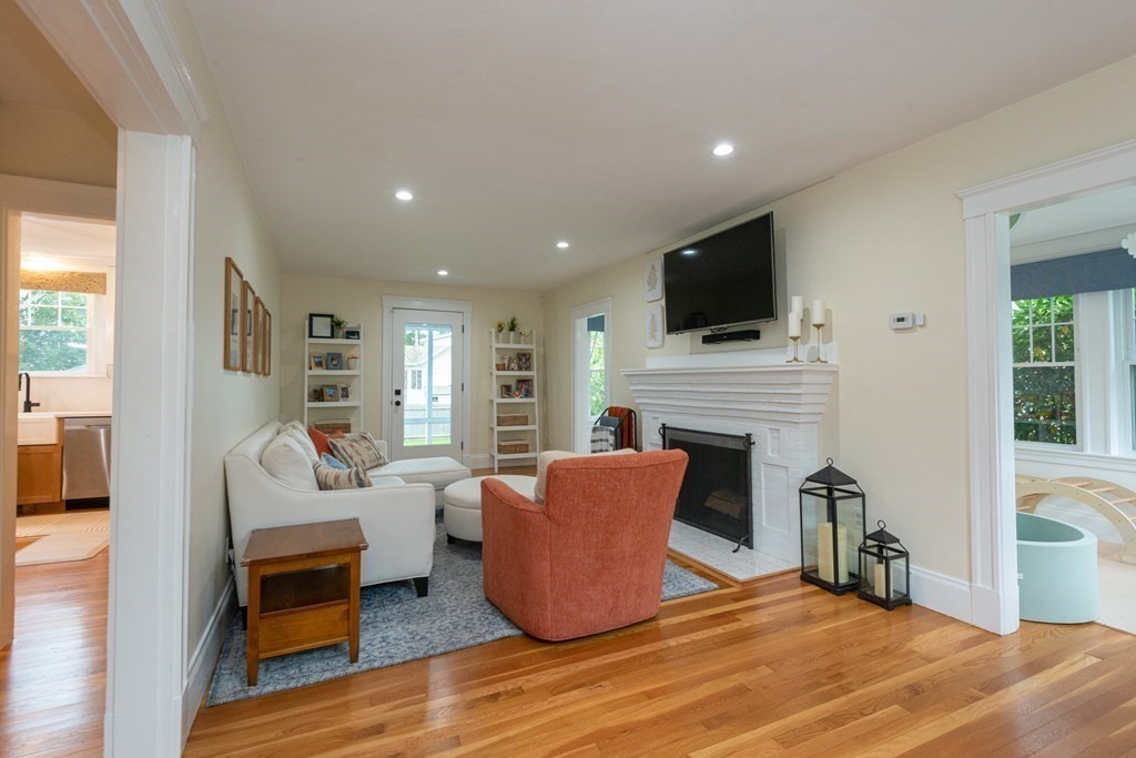 23 Trask Street Danvers, MA 01923 - Photo 14 of 42 a living room with furniture fireplace and flat screen tv