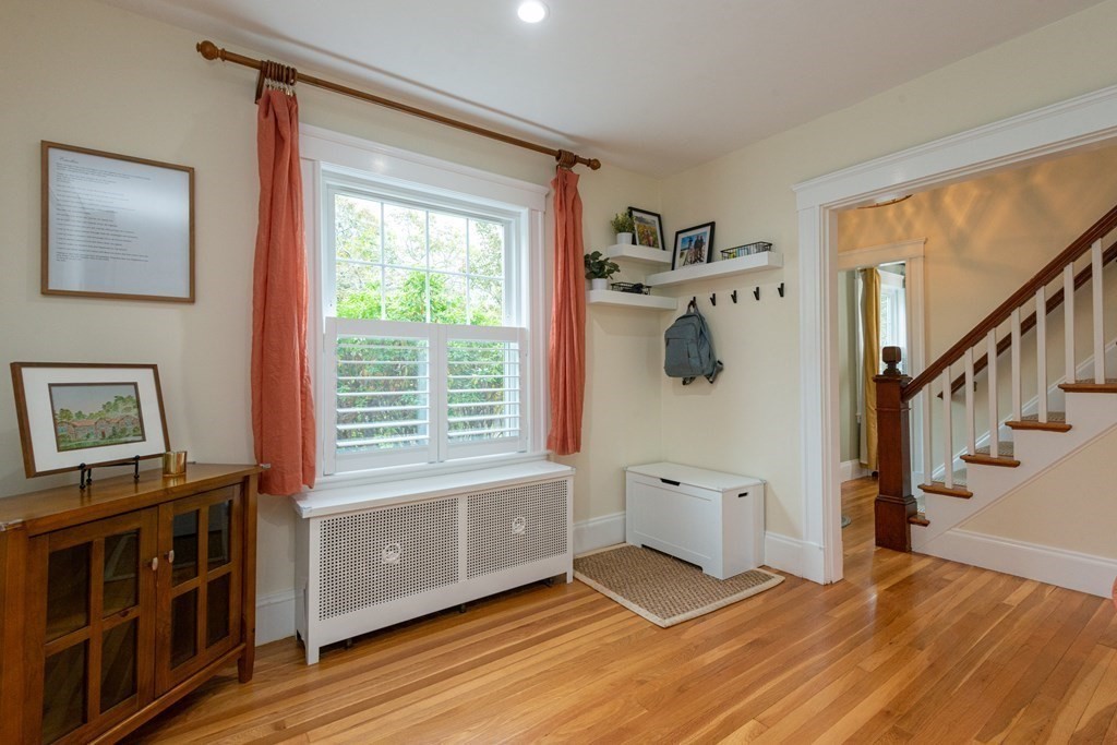 23 Trask Street Danvers, MA 01923 - Photo 17 of 42 a view of a bedroom with wooden floor and windows