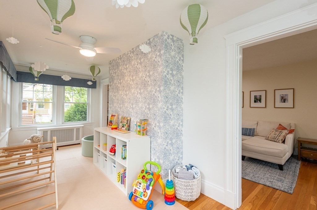 23 Trask Street Danvers, MA 01923 - Photo 21 of 42 a living room with baby crib furniture and a window