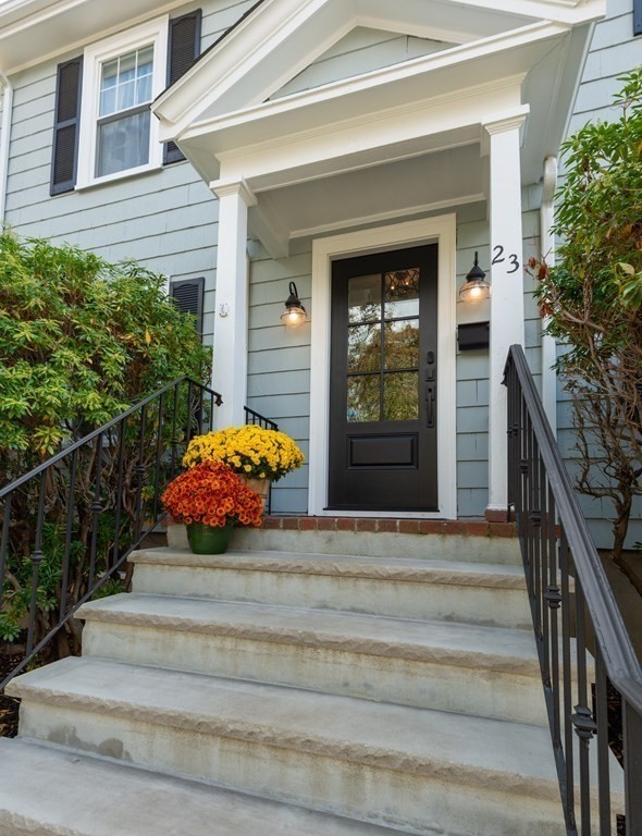 23 Trask Street Danvers, MA 01923 - Photo 3 of 42 a front view of a house with entryway