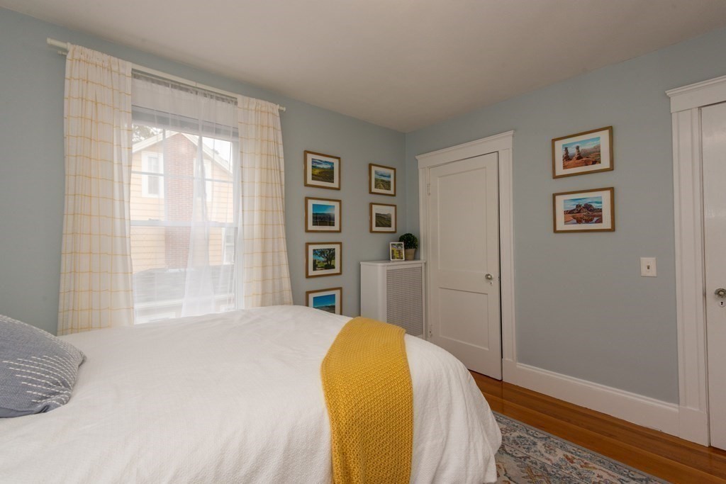 23 Trask Street Danvers, MA 01923 - Photo 31 of 42 a bedroom with a bed and a window