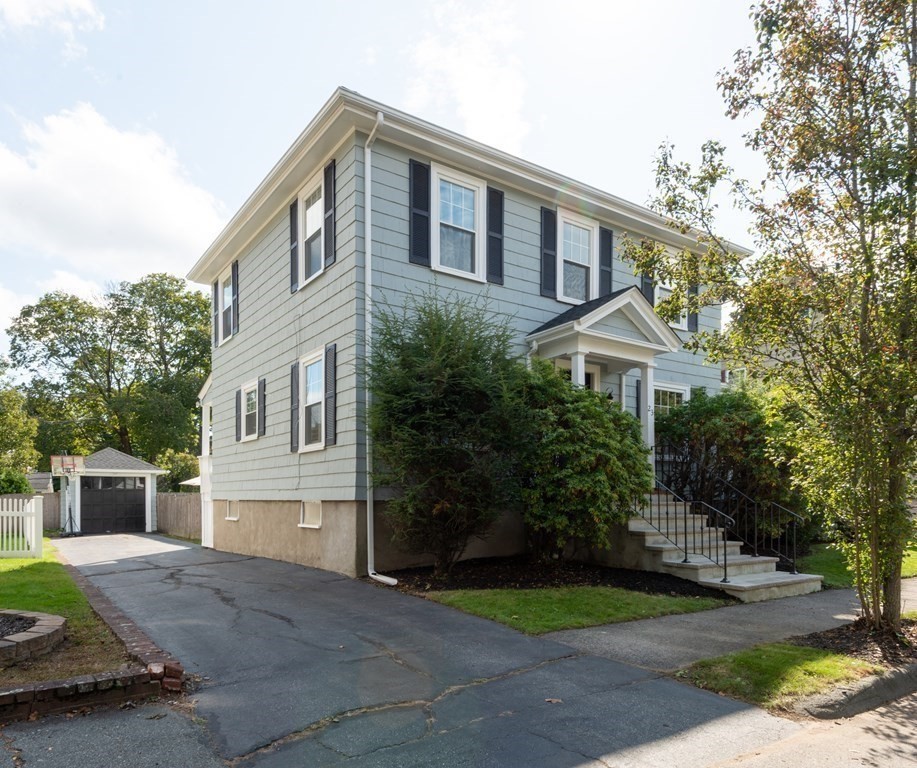 23 Trask Street Danvers, MA 01923 - Photo 37 of 42 a front view of a house with garden