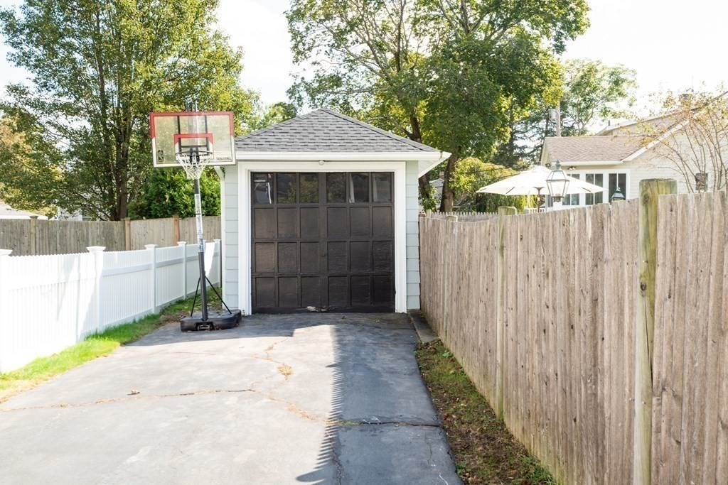23 Trask Street Danvers, MA 01923 - Photo 38 of 42 a front view of a house with a garage