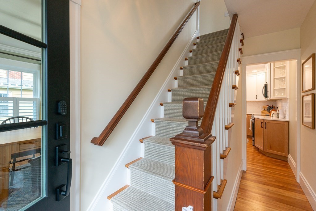 23 Trask Street Danvers, MA 01923 - Photo 4 of 42 a view of hallway with wooden floor and stairs