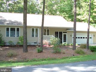47 Capetown Road Ocean Pines, MD 21811 - Photo 1 of 8 a front view of a house with garden