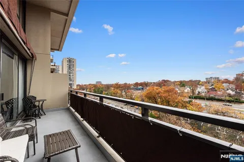 a view of balcony with furniture