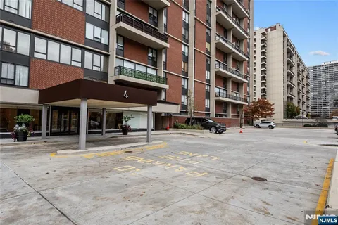 a view of a building with a street