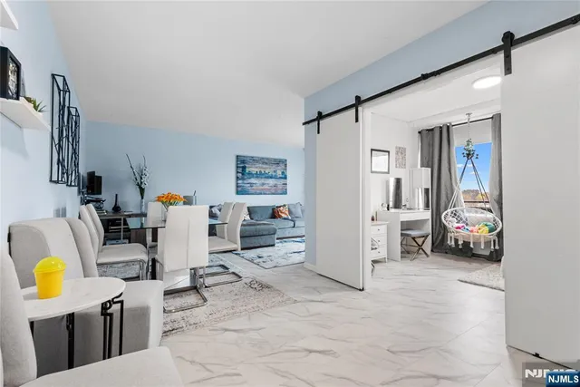 a view of living room with furniture and a flat screen tv