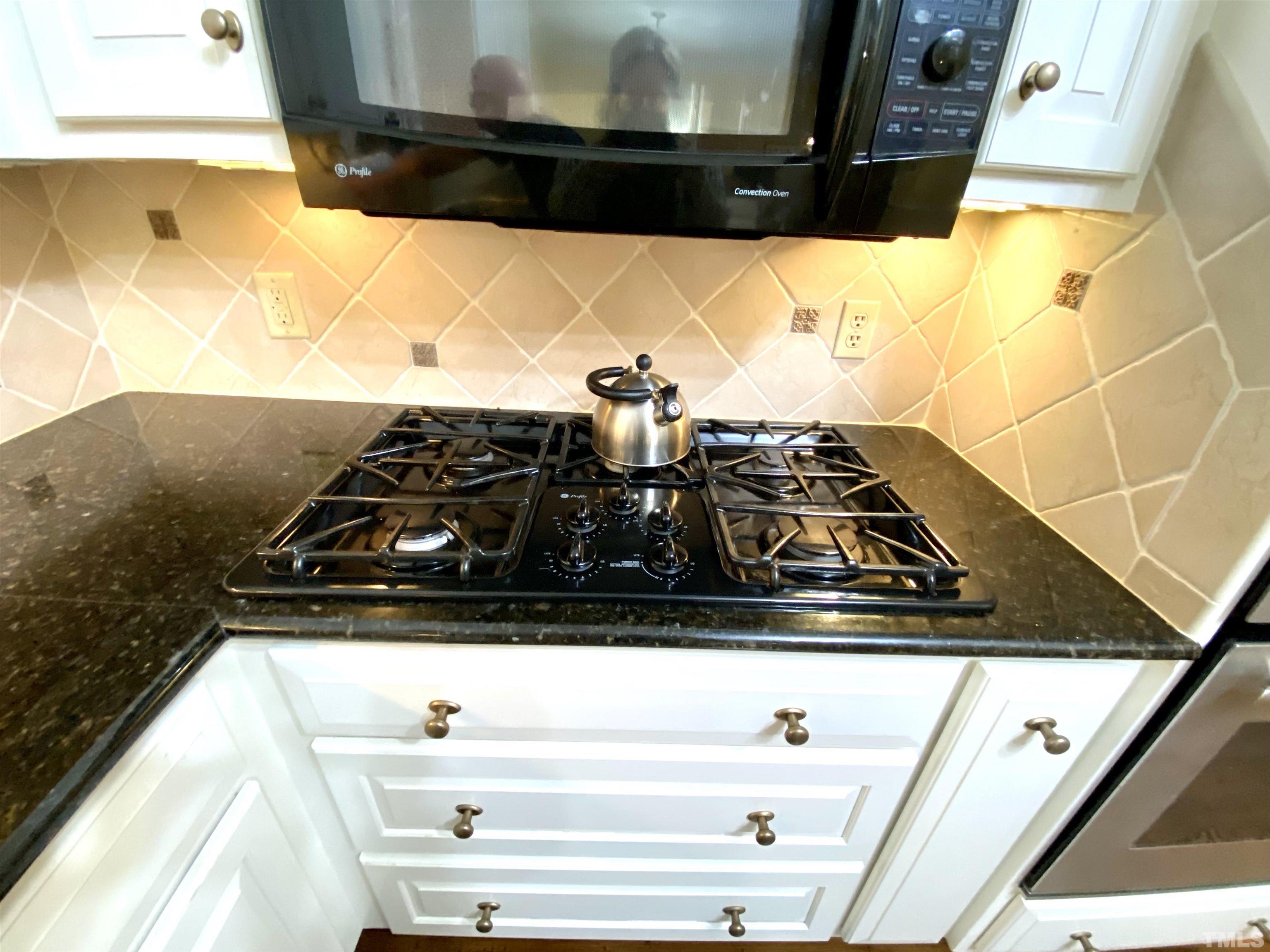 2103 Hermitage Road Northwest Wilson, NC 27896 - Photo 15 of 27 a close view of sink a microwave and stove