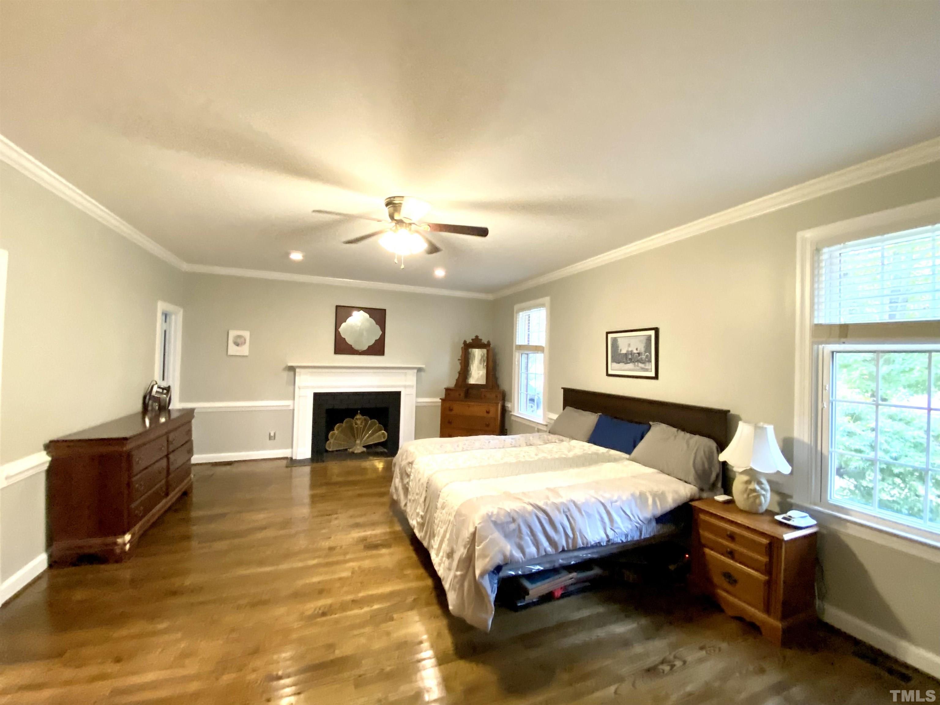 2103 Hermitage Road Northwest Wilson, NC 27896 - Photo 18 of 27 a bedroom with a bed and a fireplace