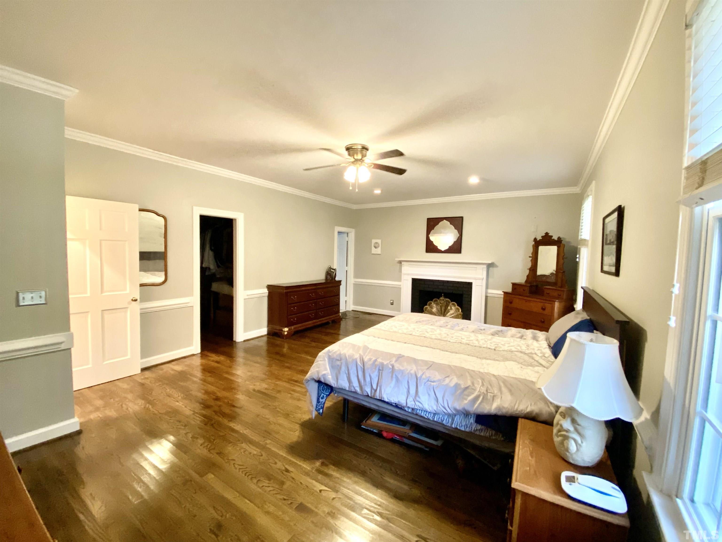 2103 Hermitage Road Northwest Wilson, NC 27896 - Photo 19 of 27 a bedroom with a bed and a fireplace