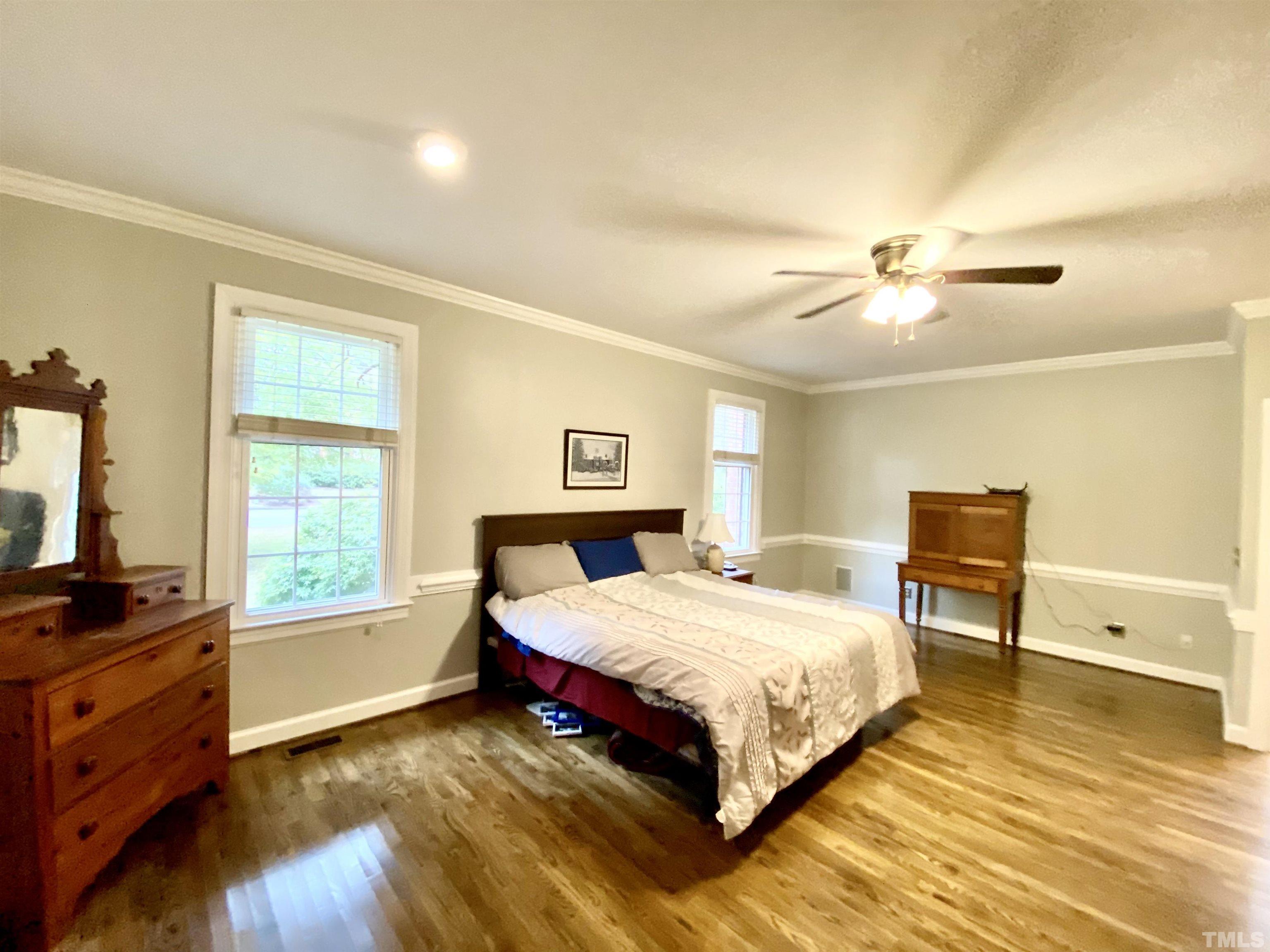 2103 Hermitage Road Northwest Wilson, NC 27896 - Photo 20 of 27 a bedroom with a bed and a flat tv screen on dresser