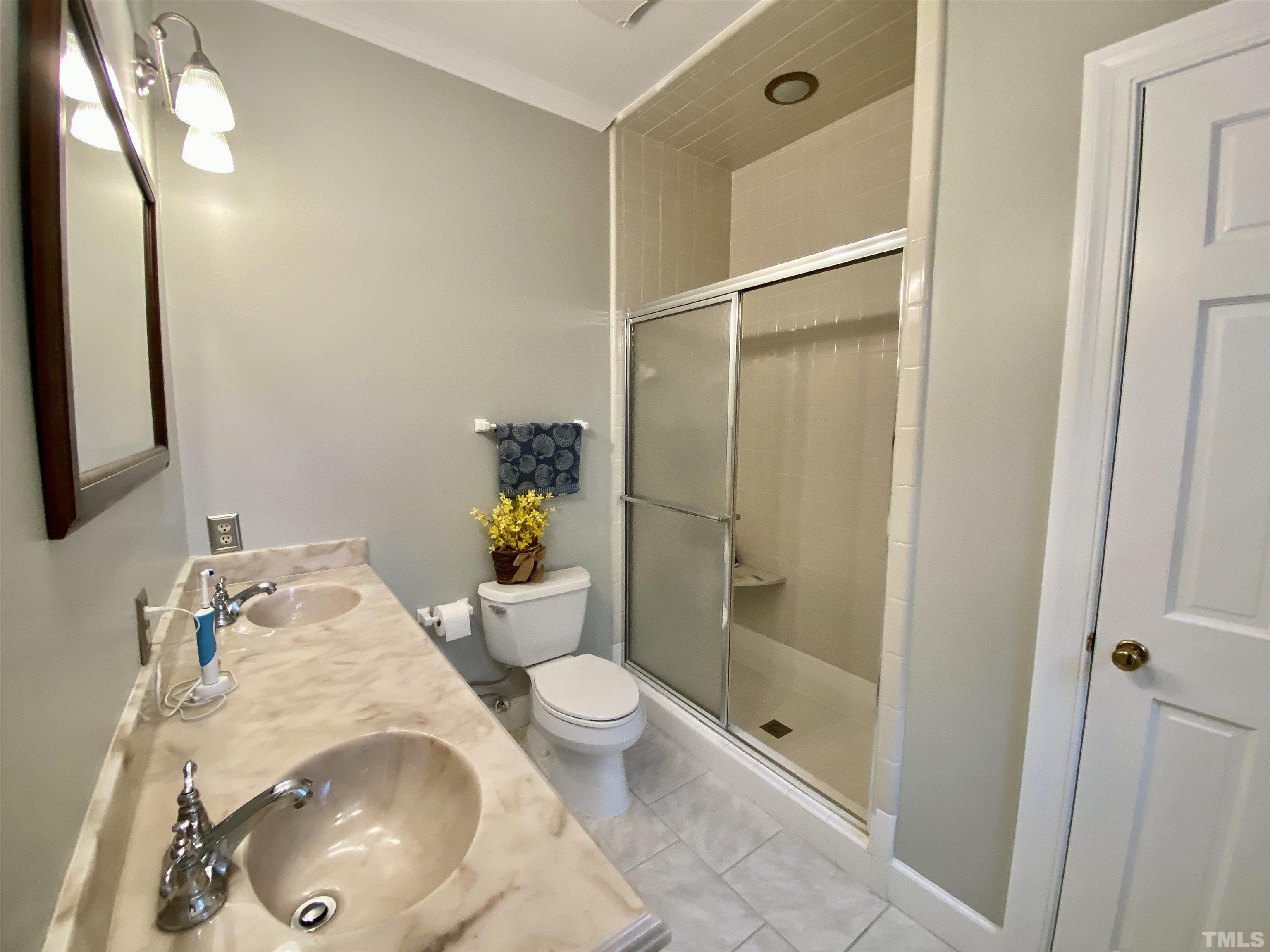 2103 Hermitage Road Northwest Wilson, NC 27896 - Photo 21 of 27 a bathroom with a granite countertop sink toilet and shower