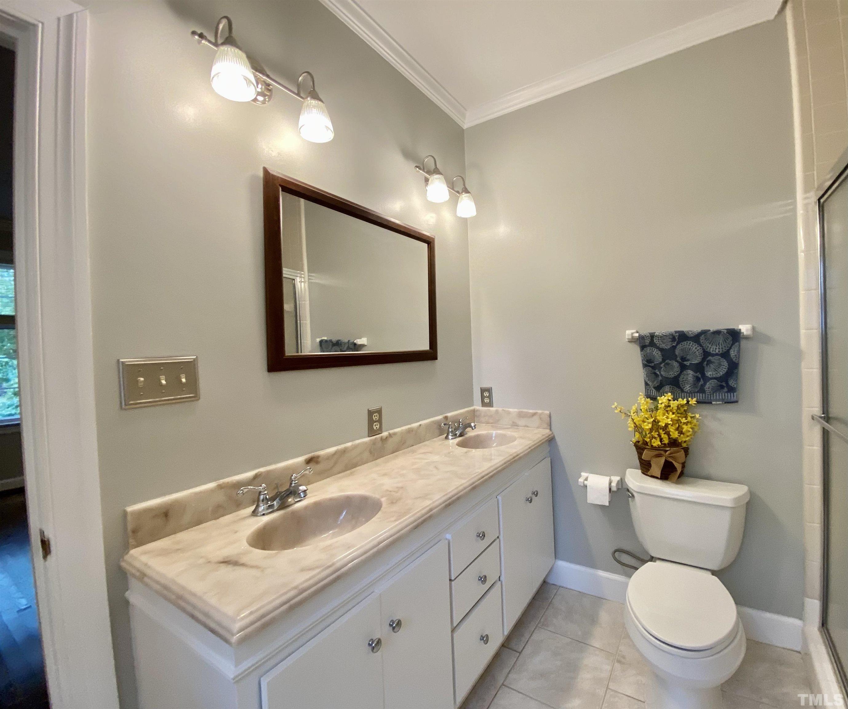 2103 Hermitage Road Northwest Wilson, NC 27896 - Photo 22 of 27 a bathroom with a toilet sink and mirror