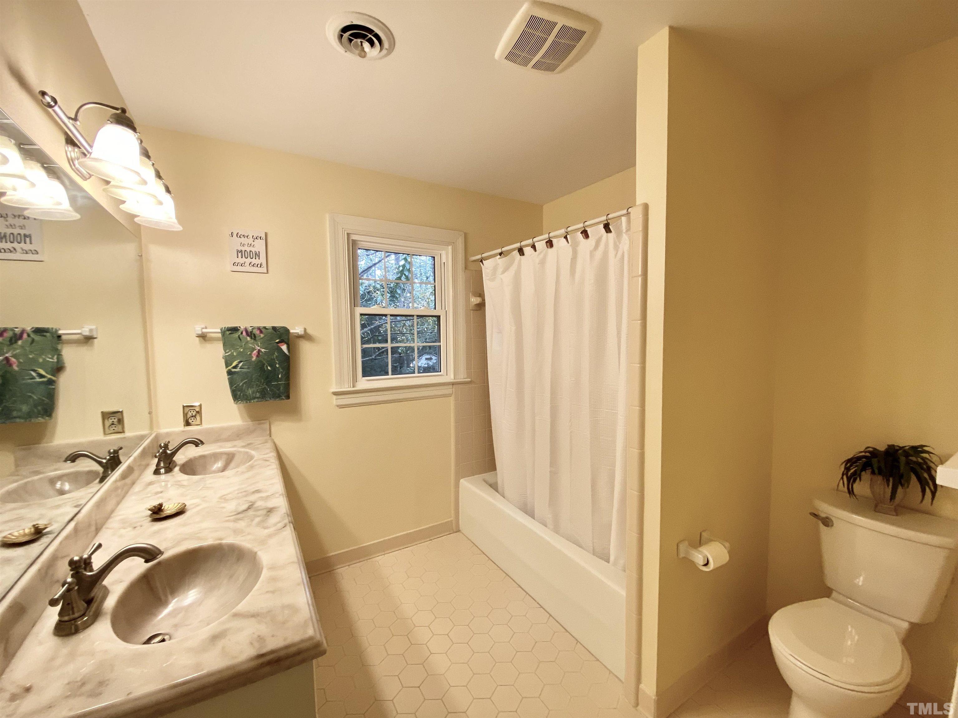 2103 Hermitage Road Northwest Wilson, NC 27896 - Photo 25 of 27 a bathroom with a sink and a toilet