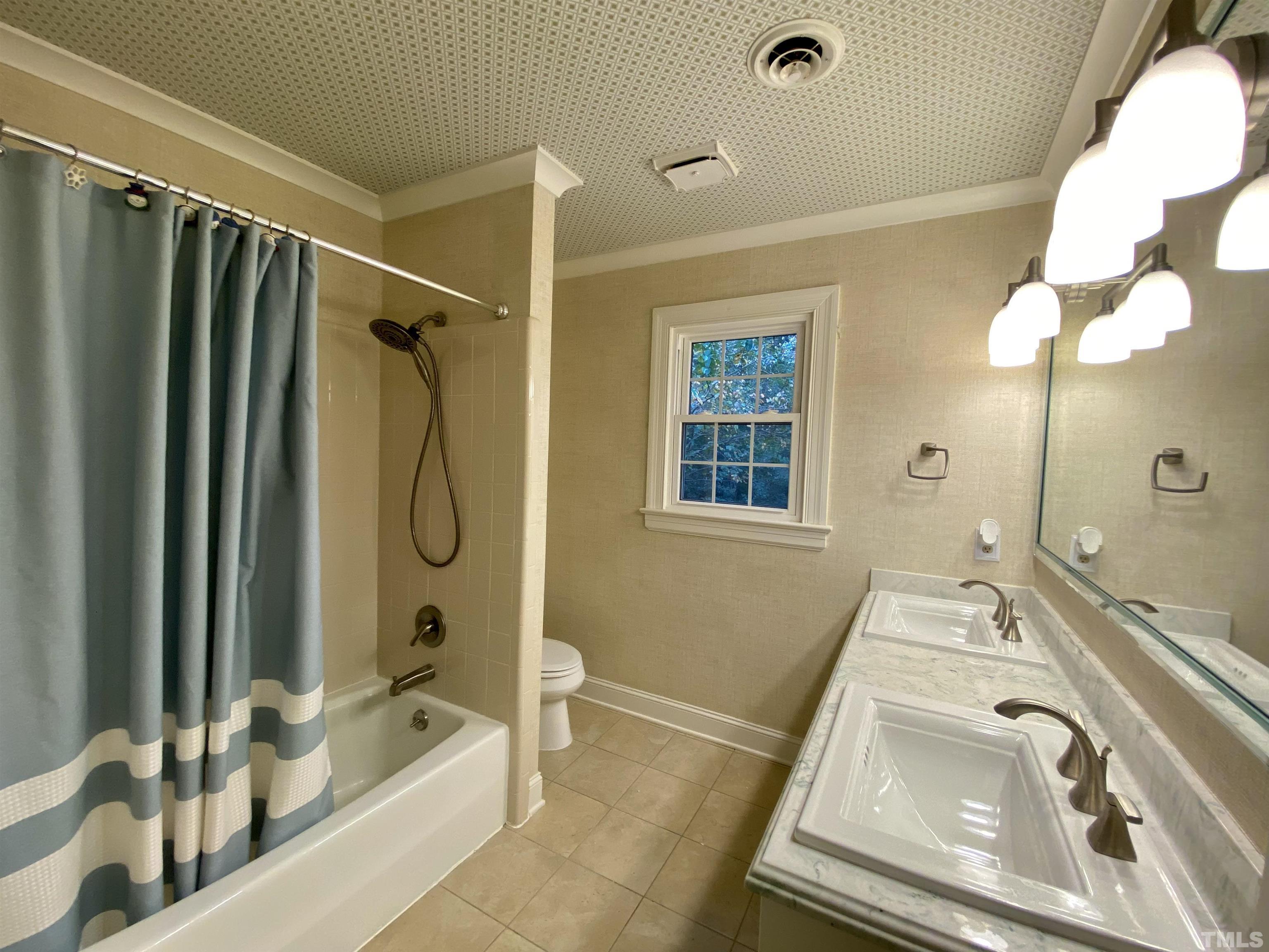 2103 Hermitage Road Northwest Wilson, NC 27896 - Photo 26 of 27 a bathroom with a tub sink and mirror