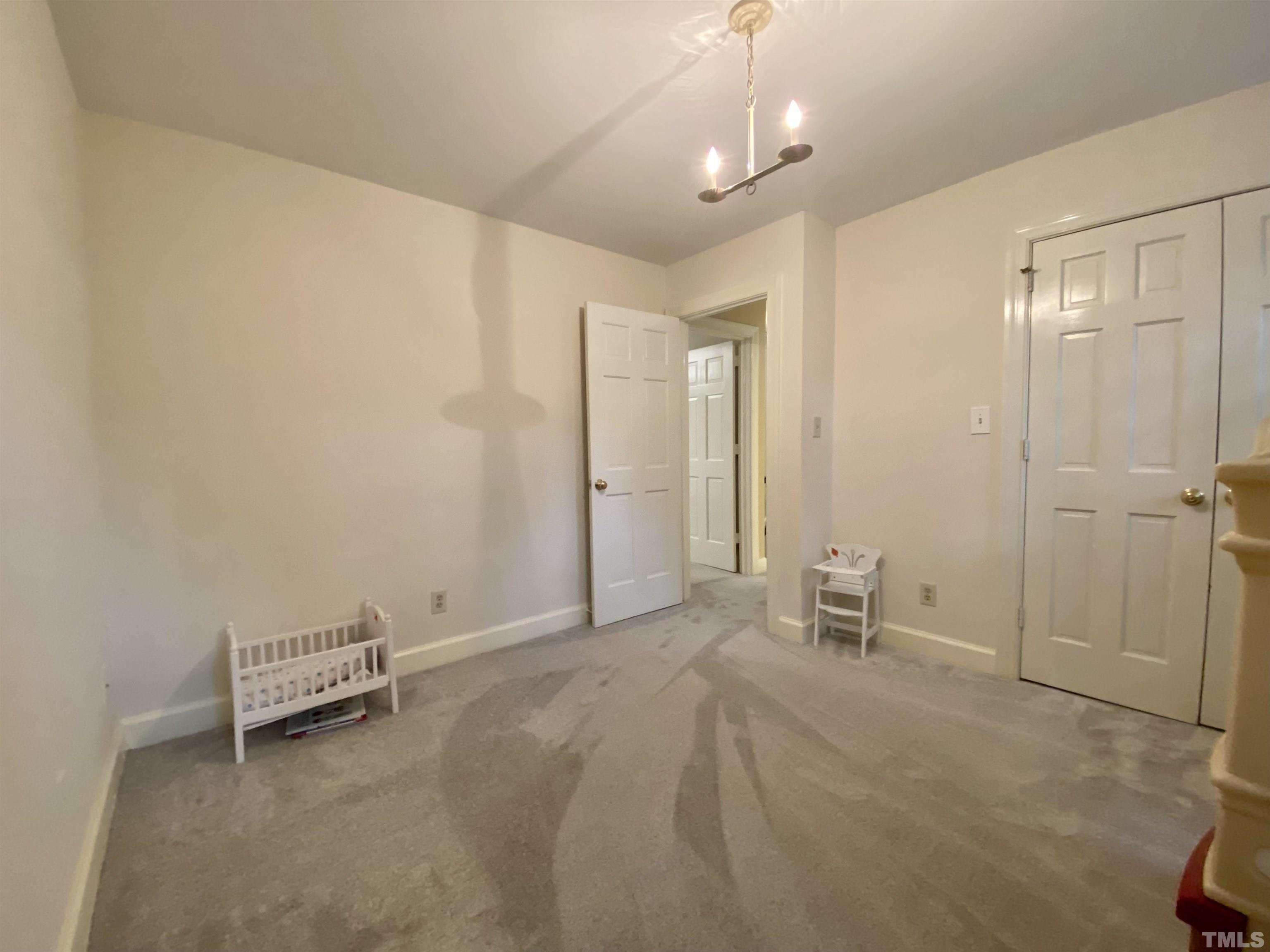 2103 Hermitage Road Northwest Wilson, NC 27896 - Photo 27 of 27 a view of a livingroom with a lounge chair and painted walls