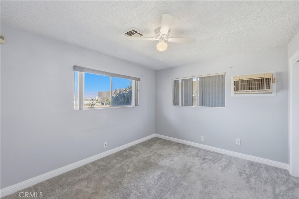 24673 Barton Road Loma Linda, CA 92354 - Photo 13 of 38 a view of an empty room with a window