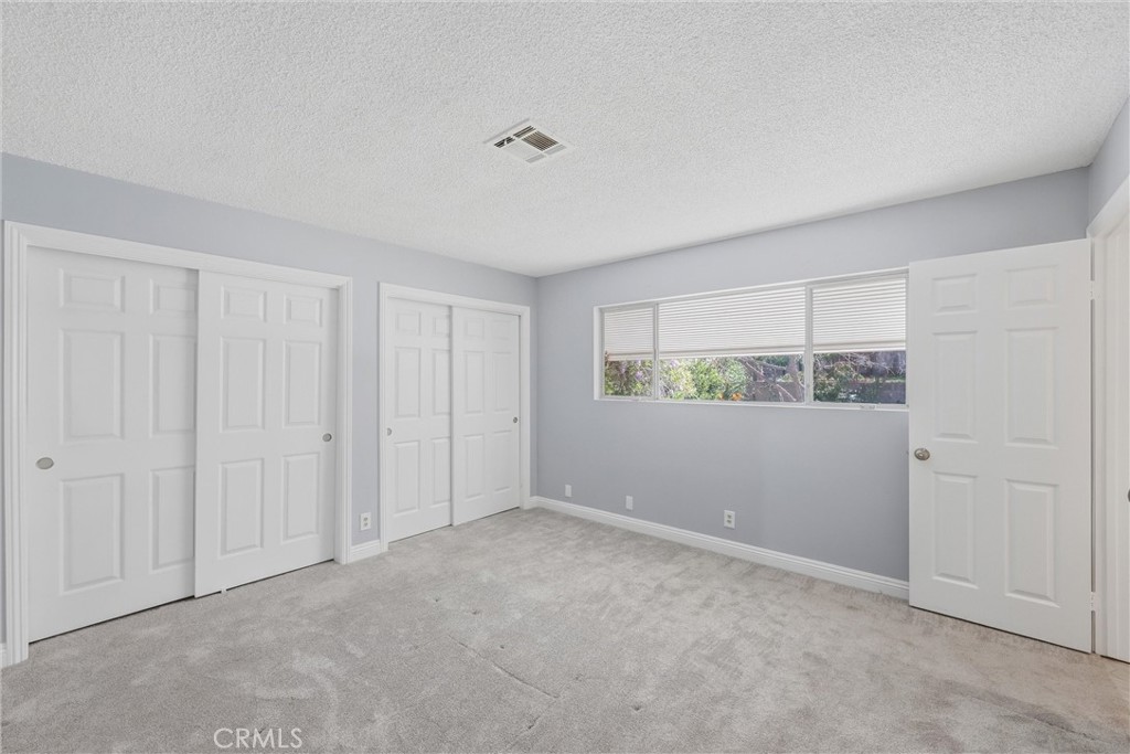 24673 Barton Road Loma Linda, CA 92354 - Photo 17 of 38 a view of an empty room with a window