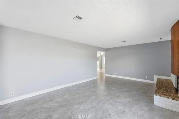 a view of a living room and chandelier
