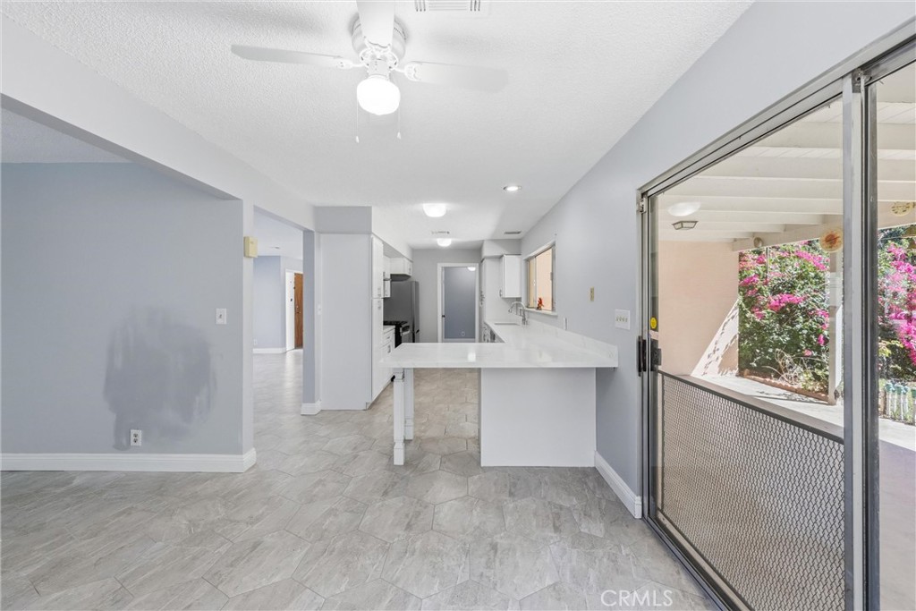 24673 Barton Road Loma Linda, CA 92354 - Photo 24 of 38 a view of a living room and chandelier