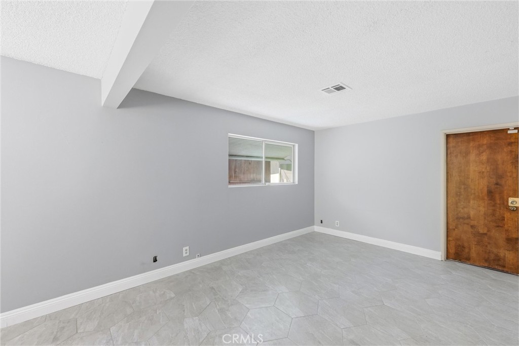 24673 Barton Road Loma Linda, CA 92354 - Photo 26 of 38 a view of an empty room with a window