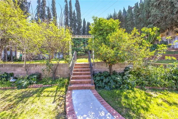 a view of swimming pool with a garden