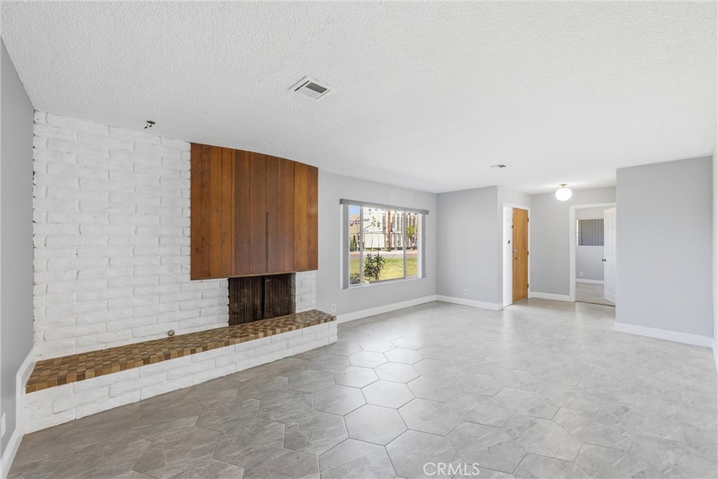 24673 Barton Road Loma Linda, CA 92354 - Photo 3 of 38 a view of an empty room with a window