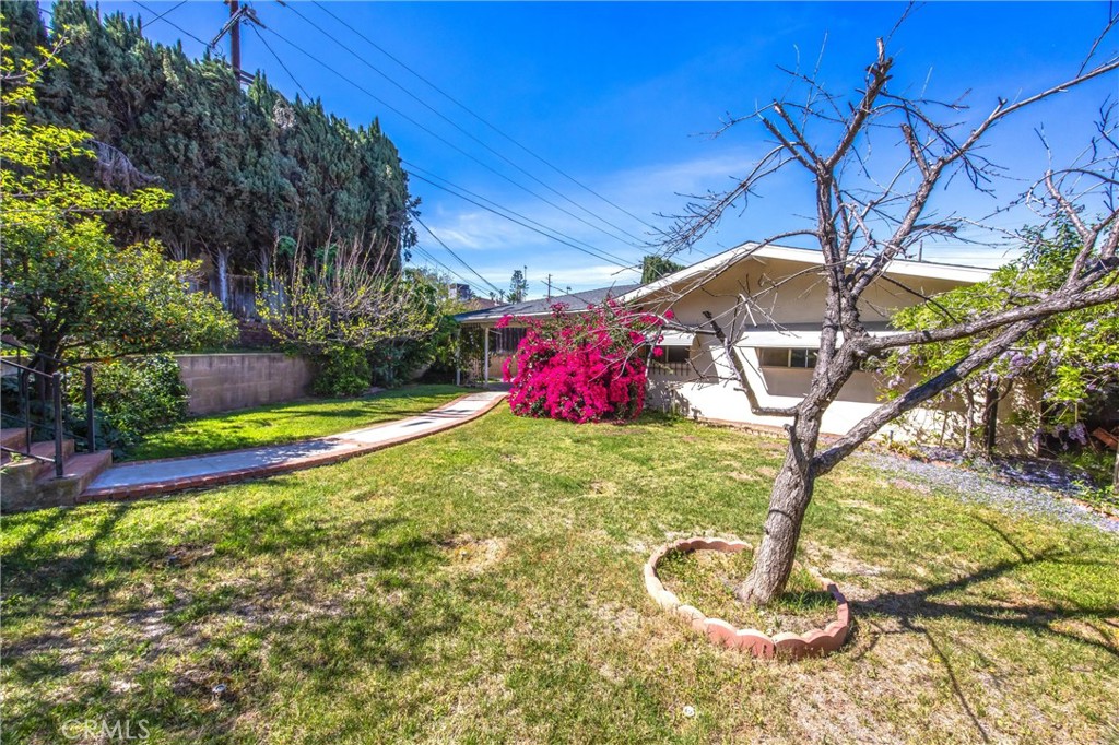 24673 Barton Road Loma Linda, CA 92354 - Photo 36 of 38 a backyard of a house with portable swimming pool and outdoor seating