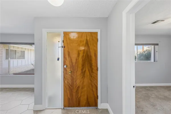 a spacious bathroom with a granite countertop sink mirror and double
