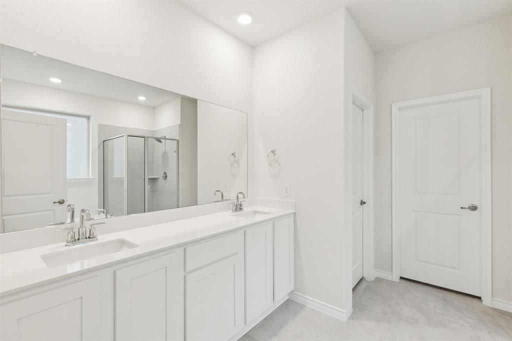 2209 Tacoma Way Anna, TX 75409 - Photo 22 of 29 a bathroom with a double vanity sink mirror and