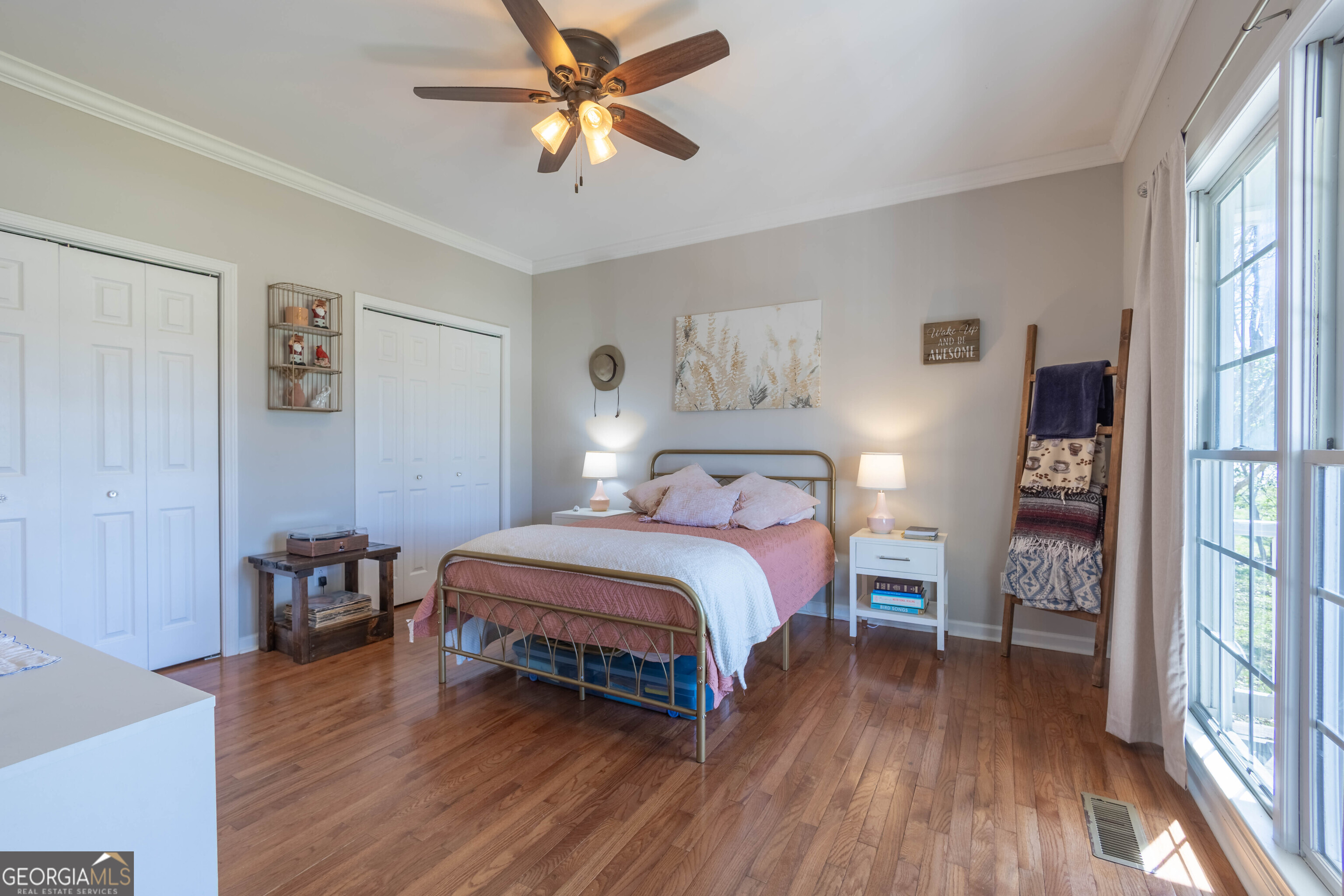 894 Highland Avenue Wadley, AL 36276 - Photo 12 of 26 a bedroom with a bed and a chandelier