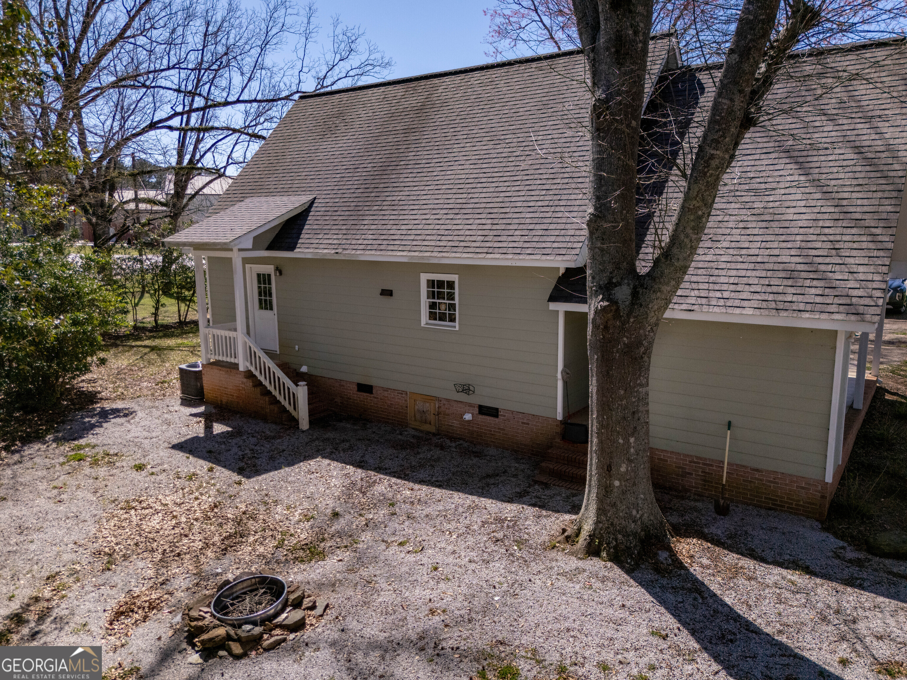 894 Highland Avenue Wadley, AL 36276 - Photo 13 of 26 a backyard of a house with barbeque oven fire pit and outdoor seating