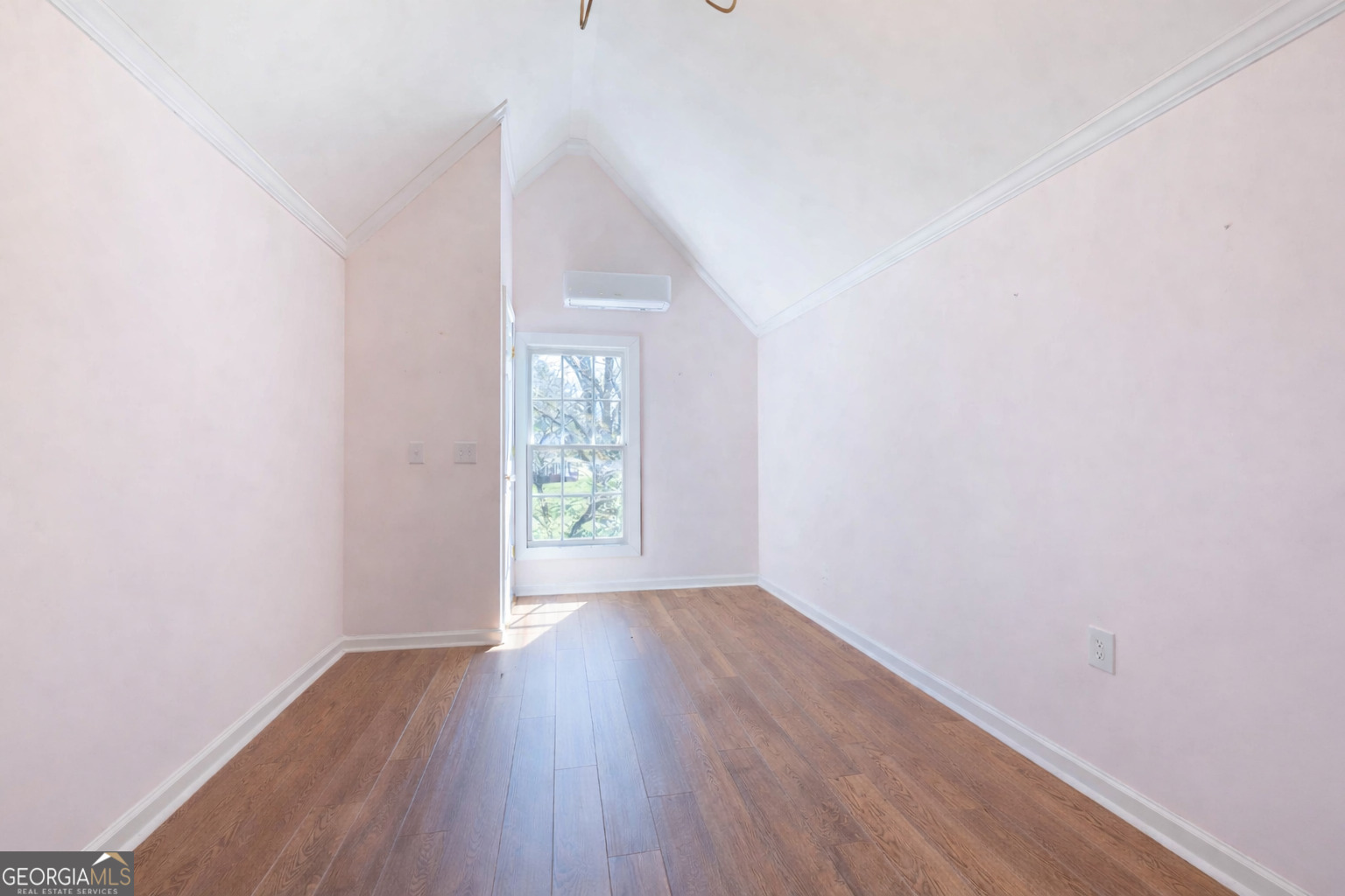 894 Highland Avenue Wadley, AL 36276 - Photo 18 of 26 a view of an empty room with wooden floor and a window
