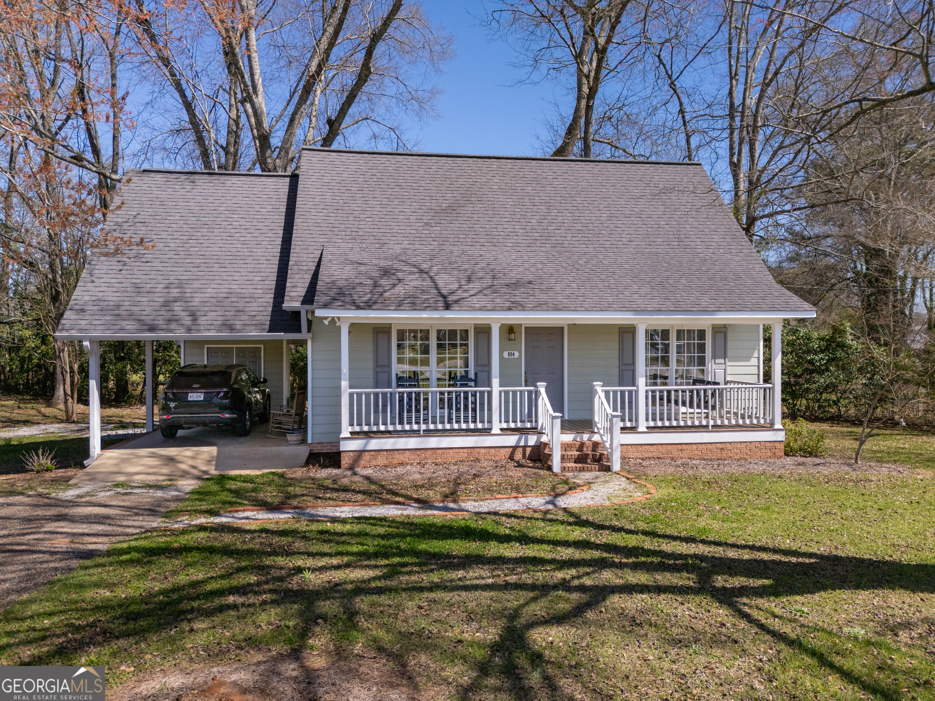 894 Highland Avenue Wadley, AL 36276 - Photo 20 of 26 a front view of a house with a yard table and chairs