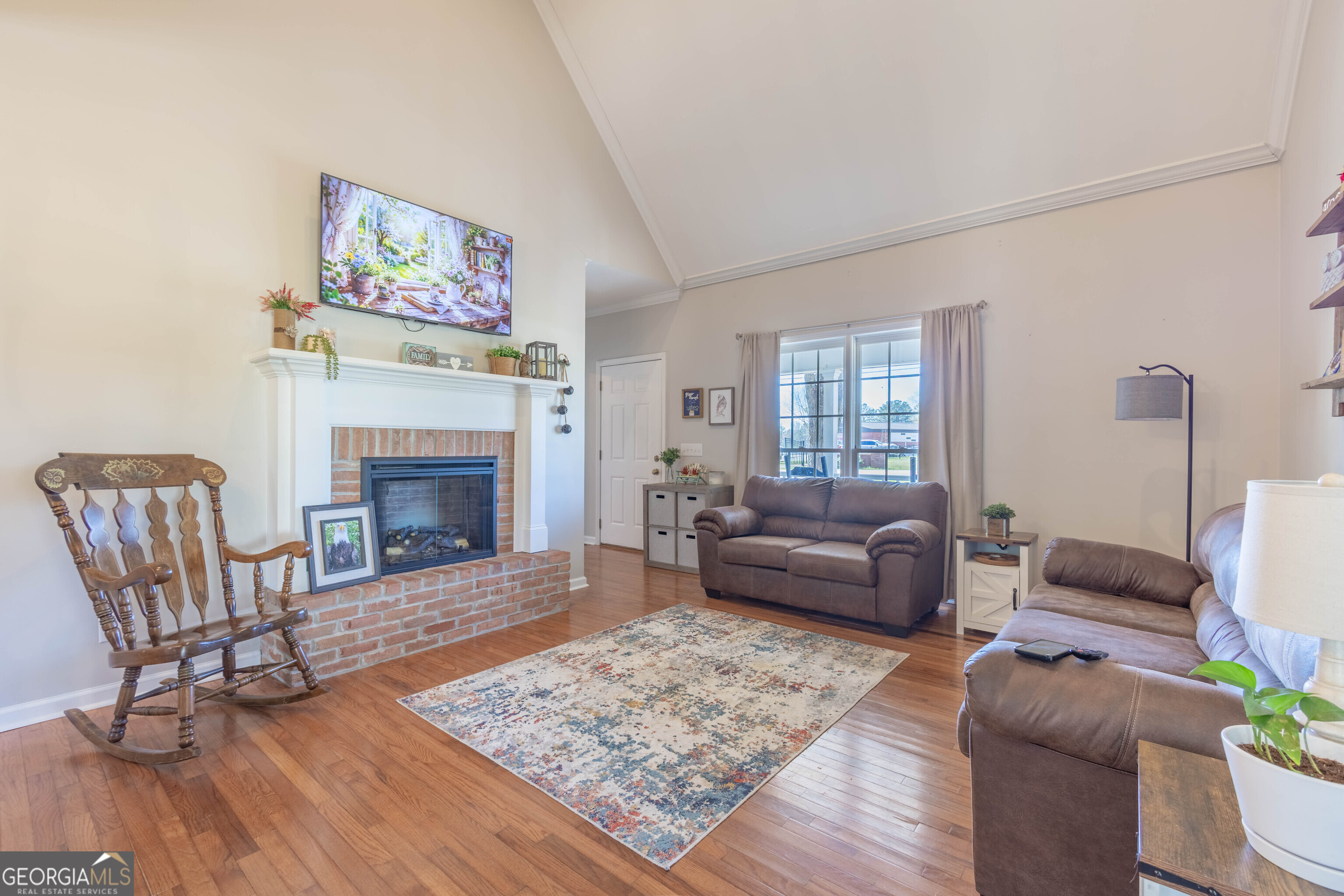 894 Highland Avenue Wadley, AL 36276 - Photo 2 of 26 a living room with furniture and a fireplace