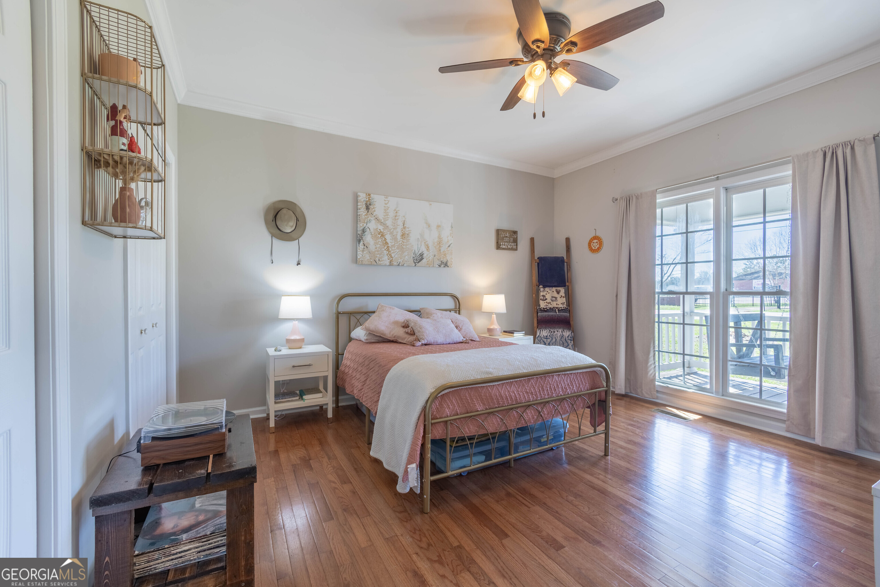 894 Highland Avenue Wadley, AL 36276 - Photo 4 of 26 a bedroom with a bed and a chandelier