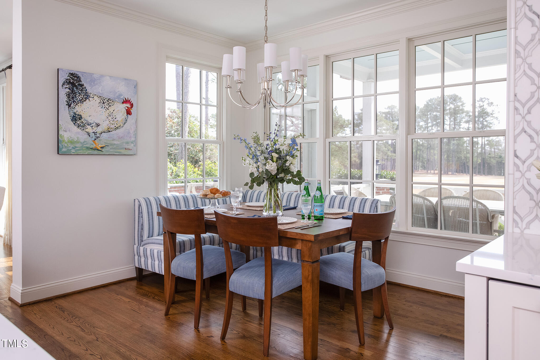 3125 Cornwall Road Durham, NC 27707 - Photo 35 of 99 a view of a dining room with furniture wooden floor and a chandelier
