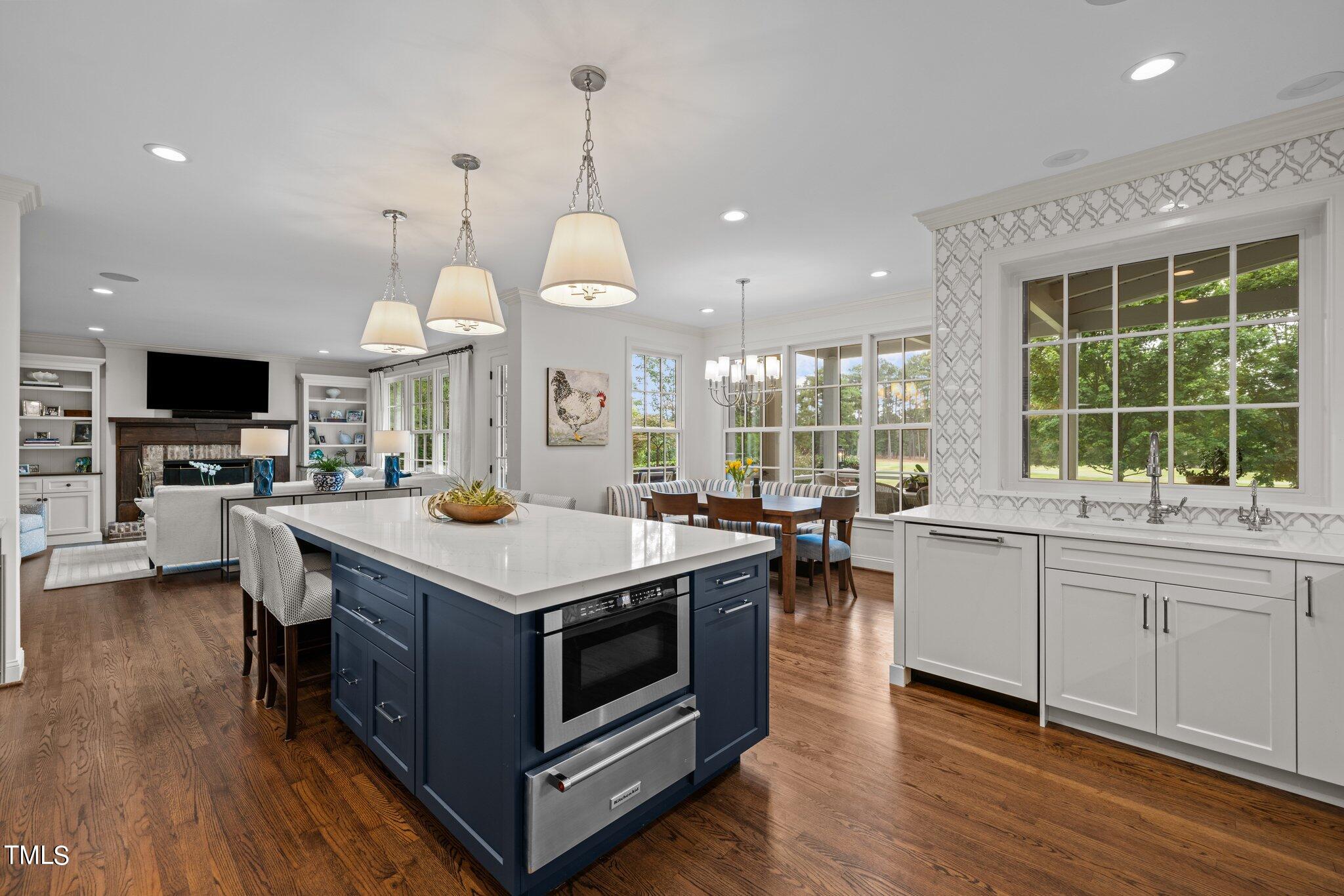 3125 Cornwall Road Durham, NC 27707 - Photo 40 of 99 a kitchen with a stove and a wooden floor