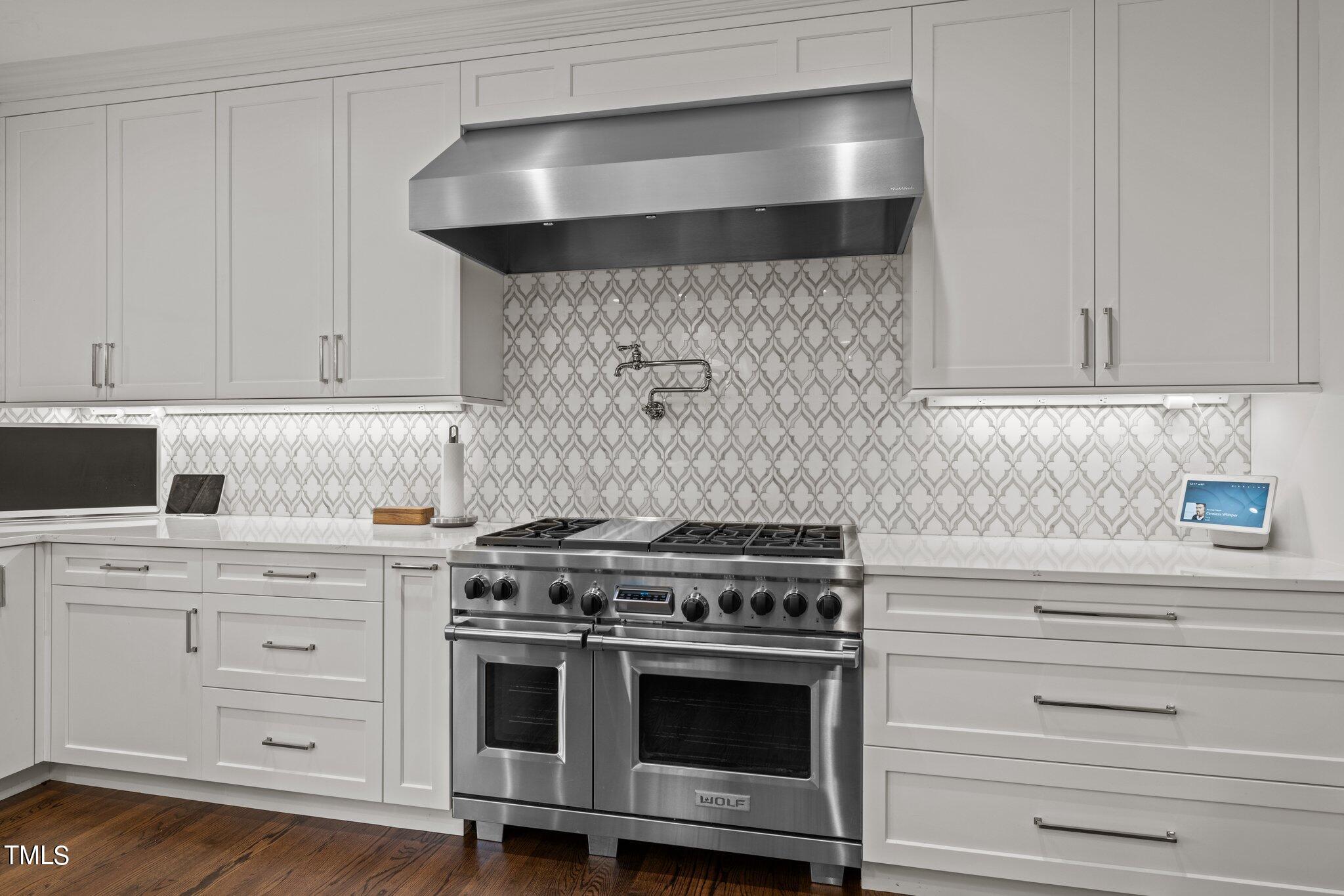 3125 Cornwall Road Durham, NC 27707 - Photo 41 of 99 a stove top oven sitting inside of a kitchen