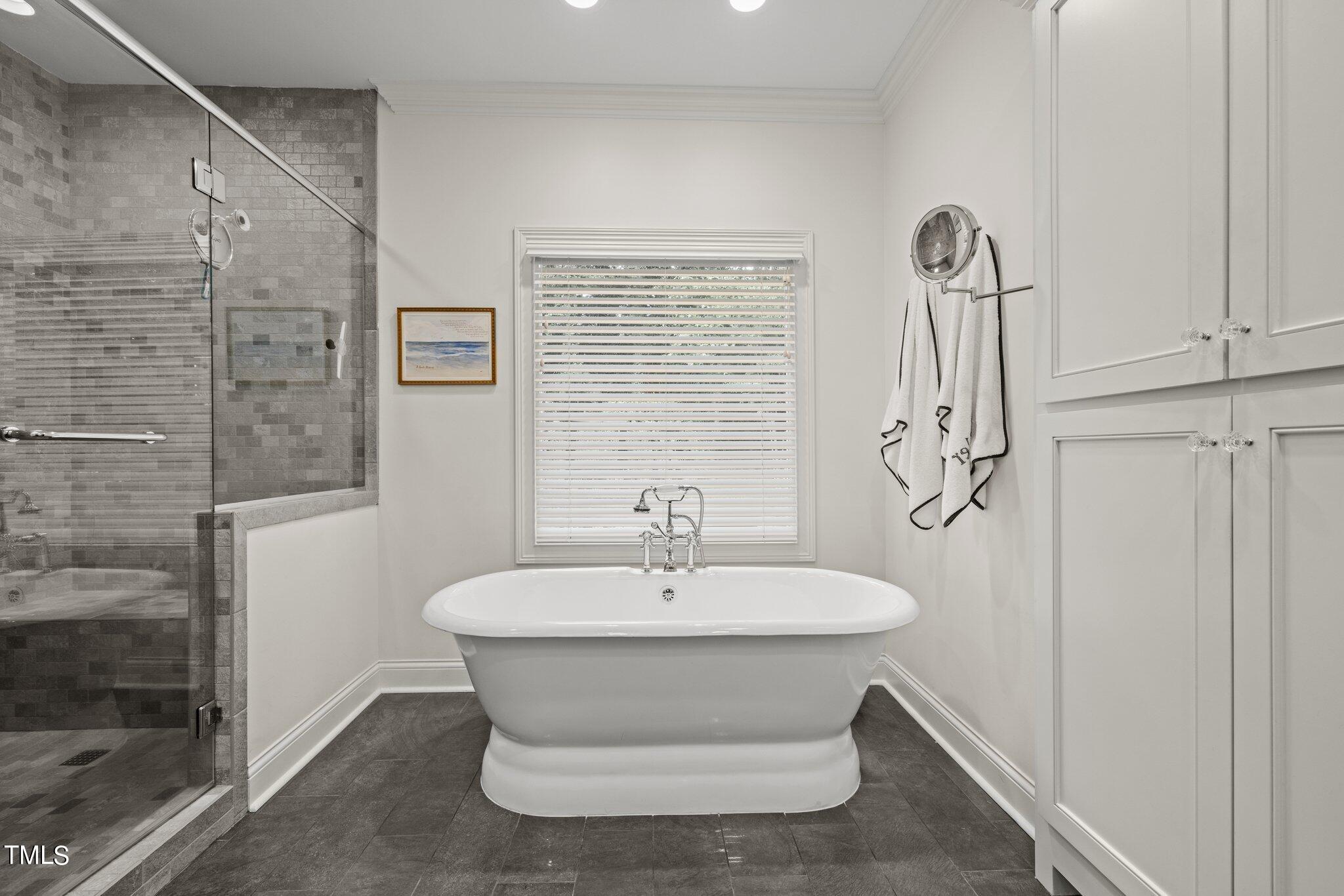 3125 Cornwall Road Durham, NC 27707 - Photo 54 of 99 a bathroom with a sink and a mirror