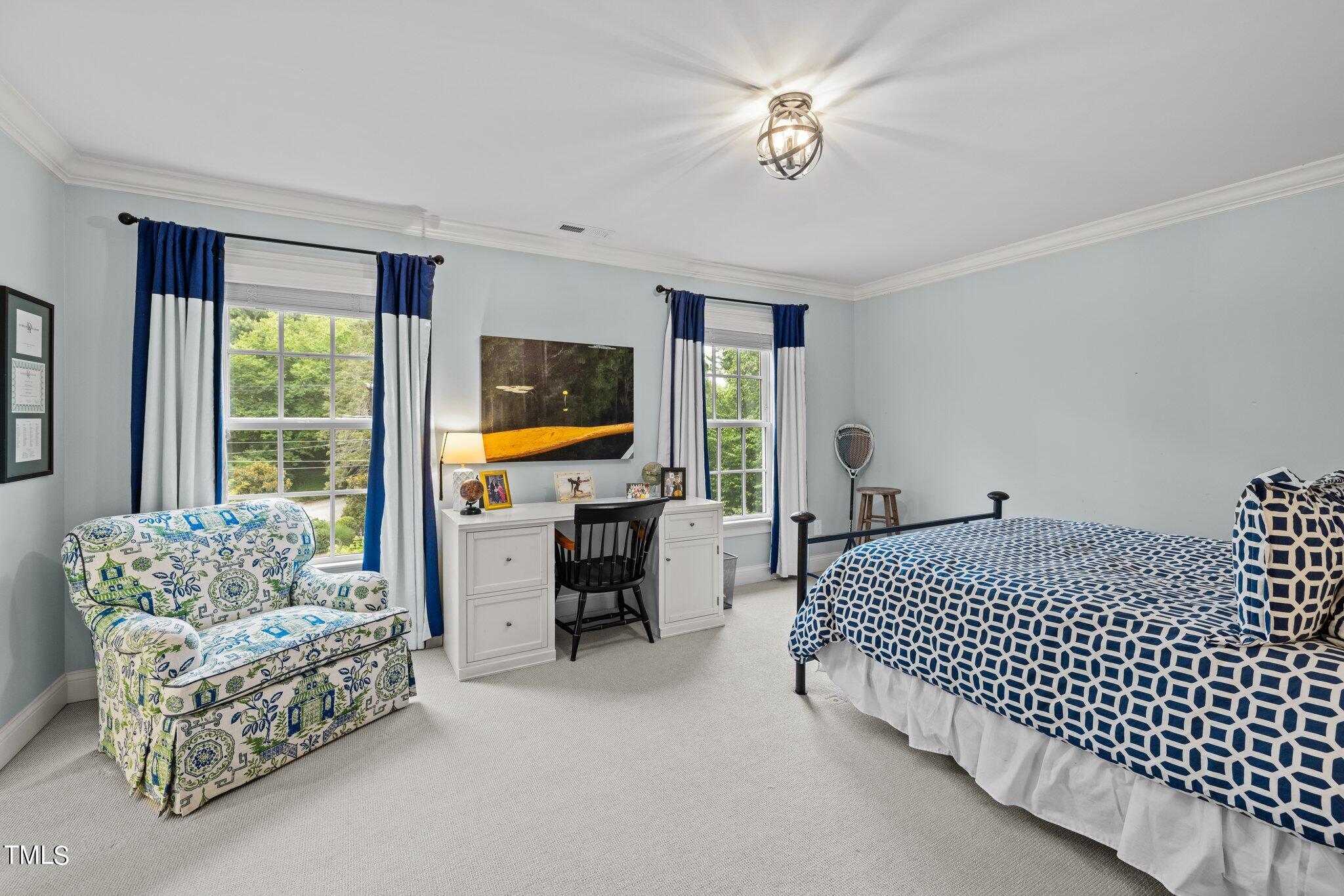 3125 Cornwall Road Durham, NC 27707 - Photo 58 of 99 a bedroom with furniture and a flat screen tv