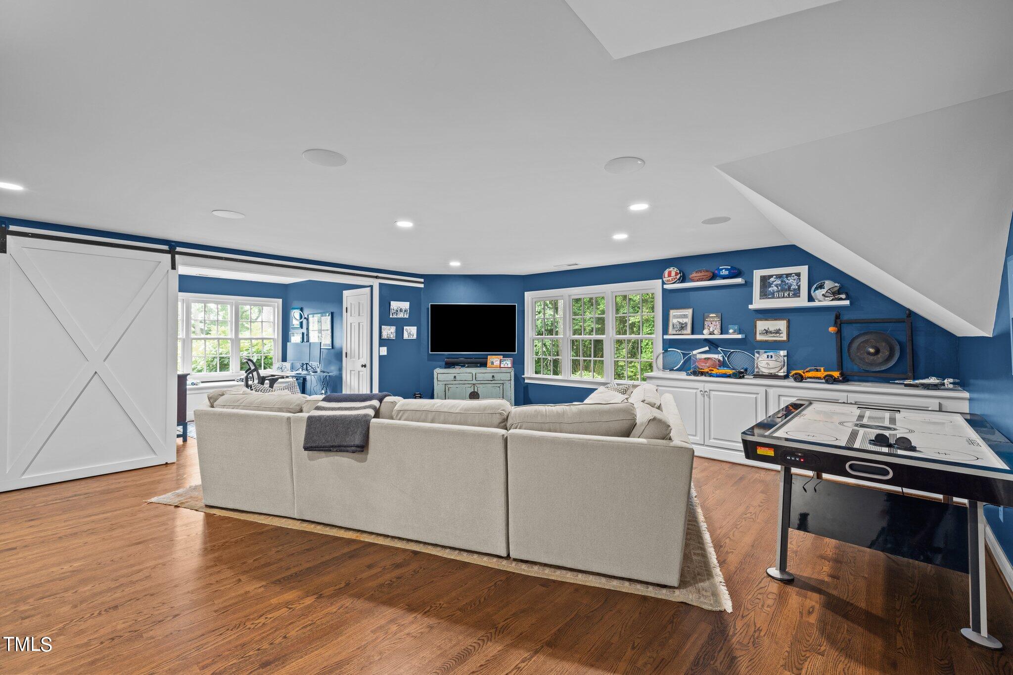 3125 Cornwall Road Durham, NC 27707 - Photo 71 of 99 a living room with furniture and a flat screen tv