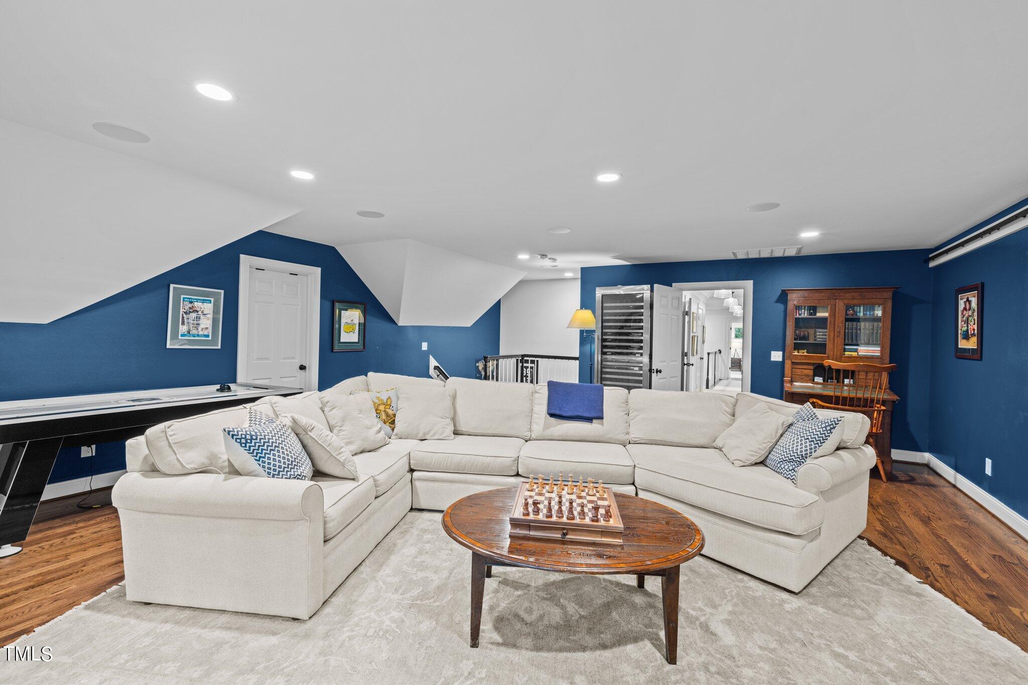 3125 Cornwall Road Durham, NC 27707 - Photo 74 of 99 a living room with furniture and a wooden floor