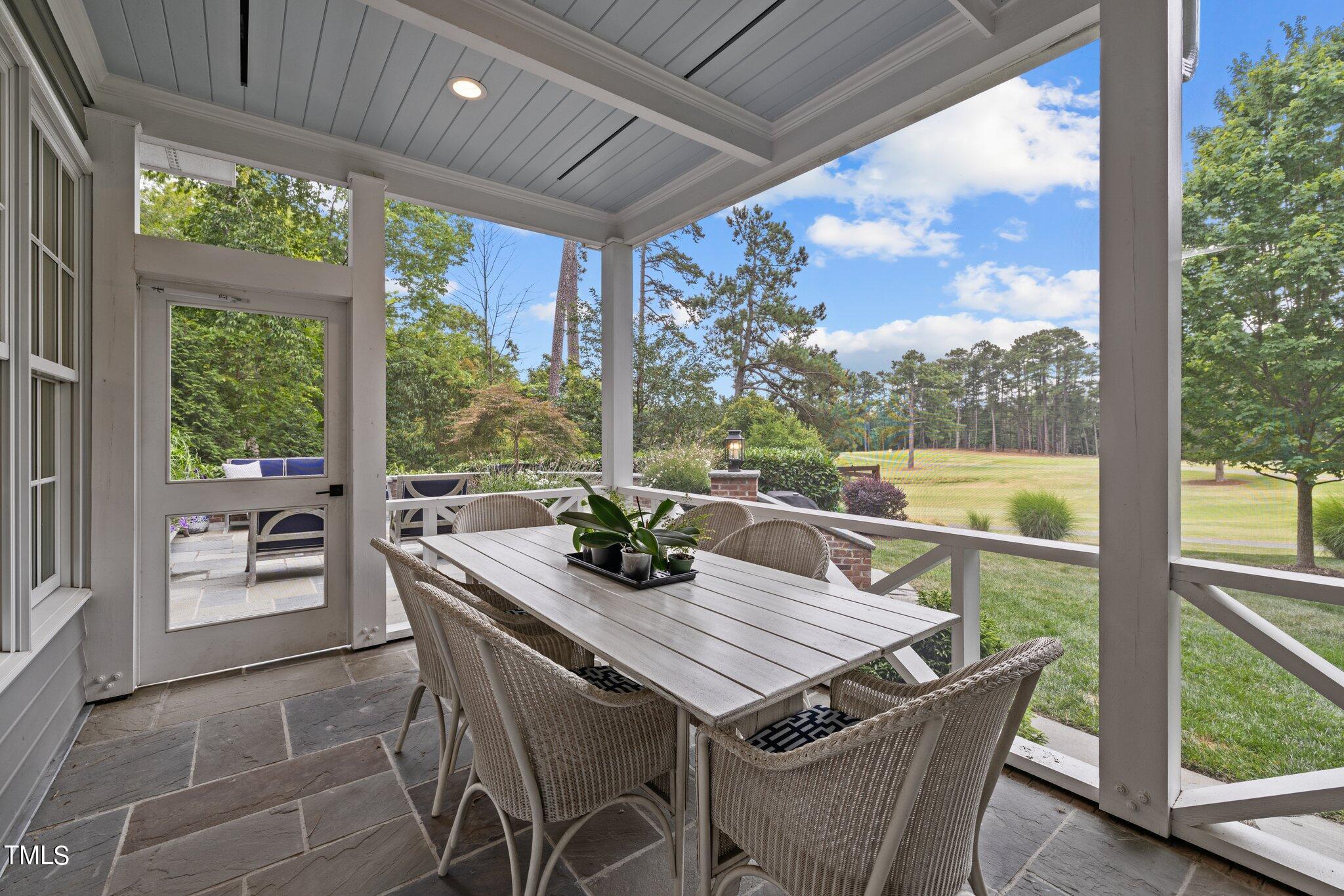3125 Cornwall Road Durham, NC 27707 - Photo 81 of 99 a view of a patio with a table chairs and a table