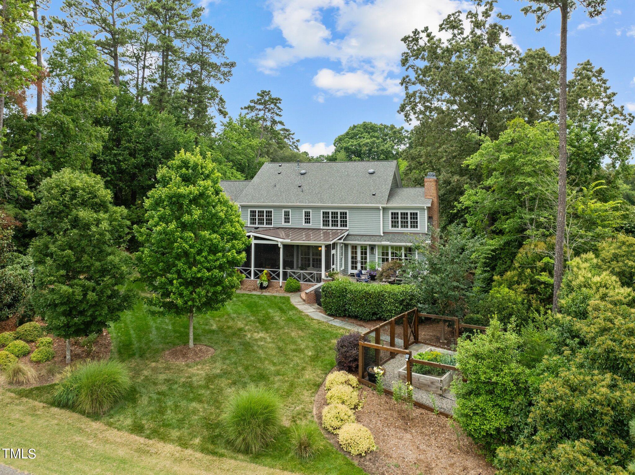 3125 Cornwall Road Durham, NC 27707 - Photo 92 of 99 a view of a house with a yard and sitting area