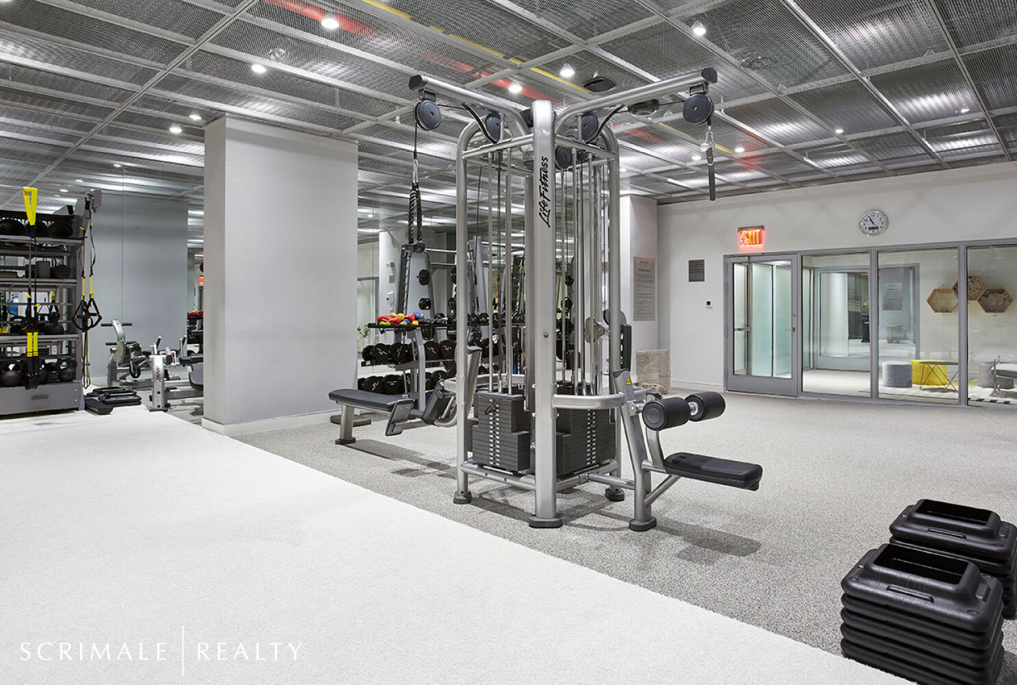 200 East 66th Street, Unit C402 Manhattan, NY 10065 - Photo 11 of 15 a view of a room with gym equipment