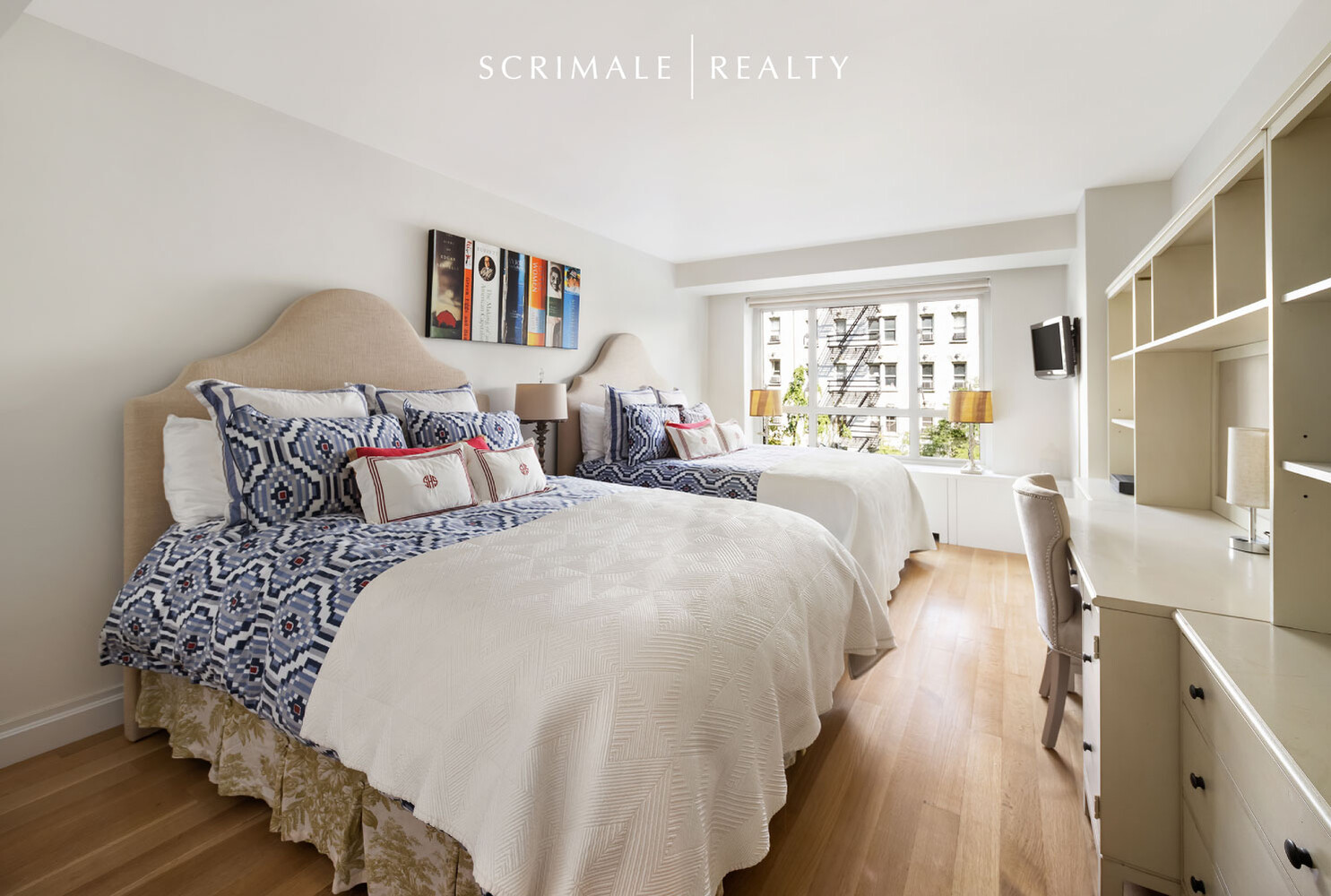 200 East 66th Street, Unit C402 Manhattan, NY 10065 - Photo 4 of 15 a spacious bedroom with a bed and a large window