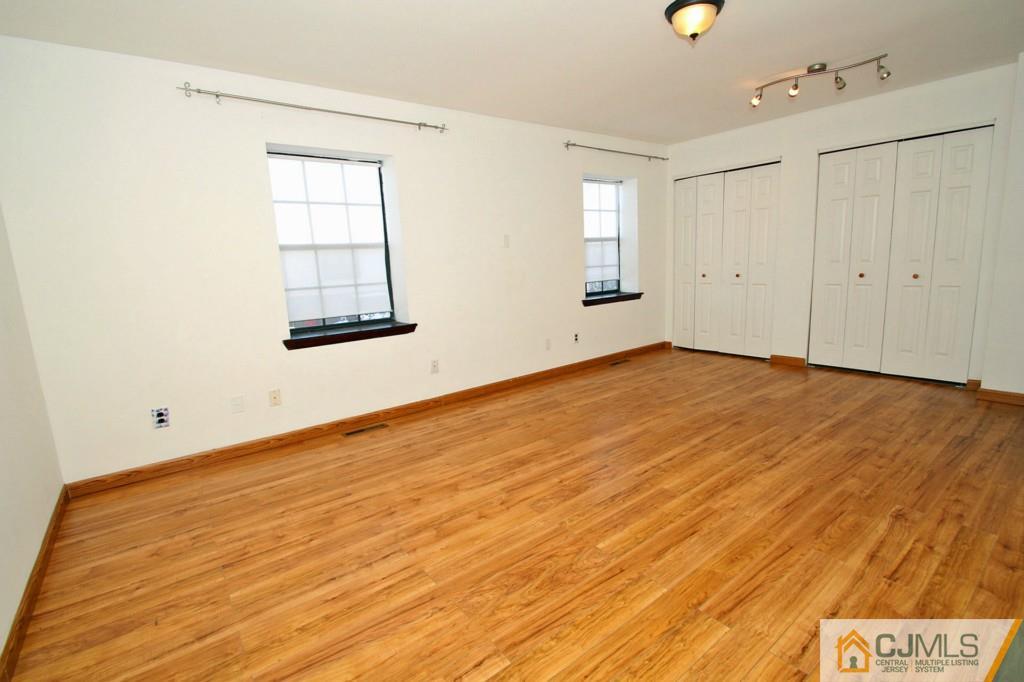 7705 Hana Road Edison, NJ 08817 - Photo 22 of 25 an empty room with windows