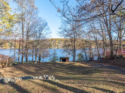 a view of street with wooden fence